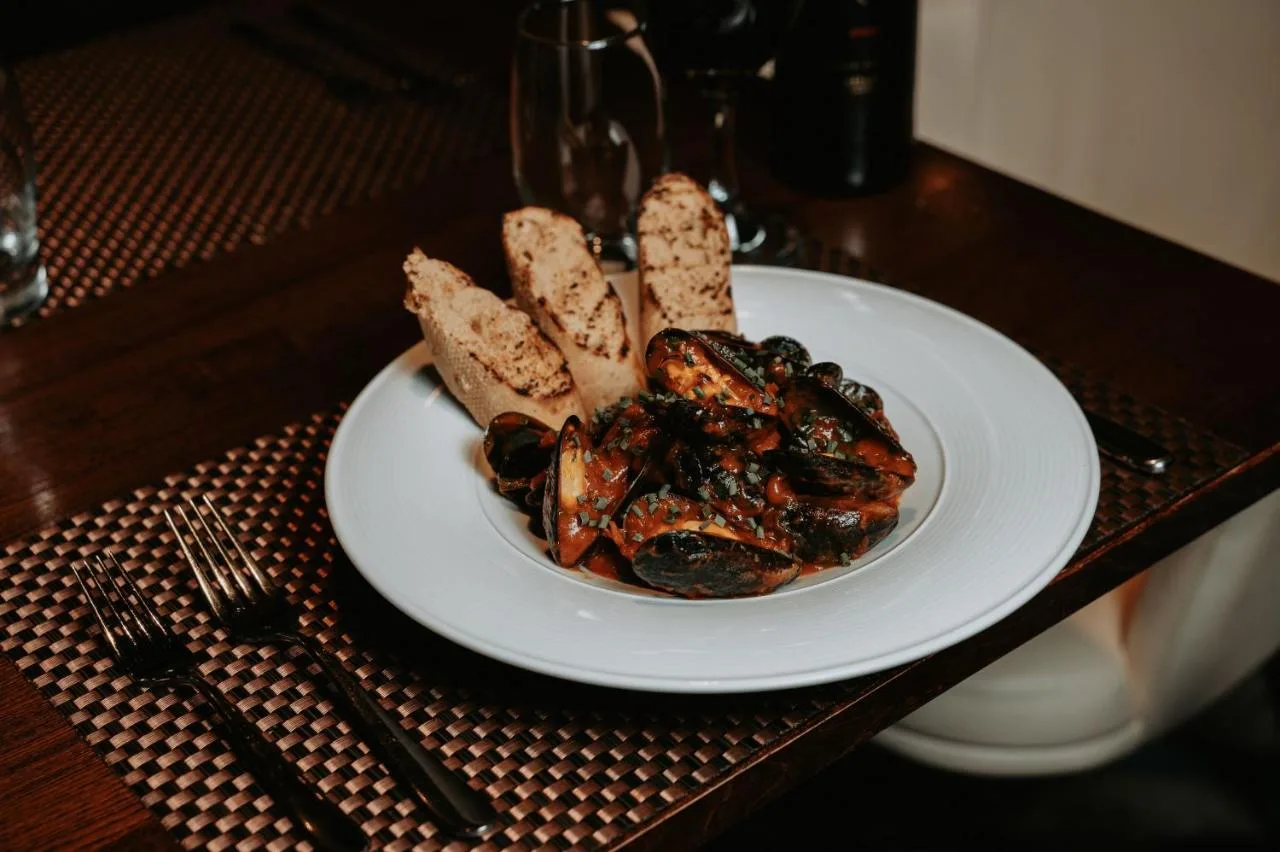 a white plate of food on a table at Clayton Hotel Birmingham in Birmingham